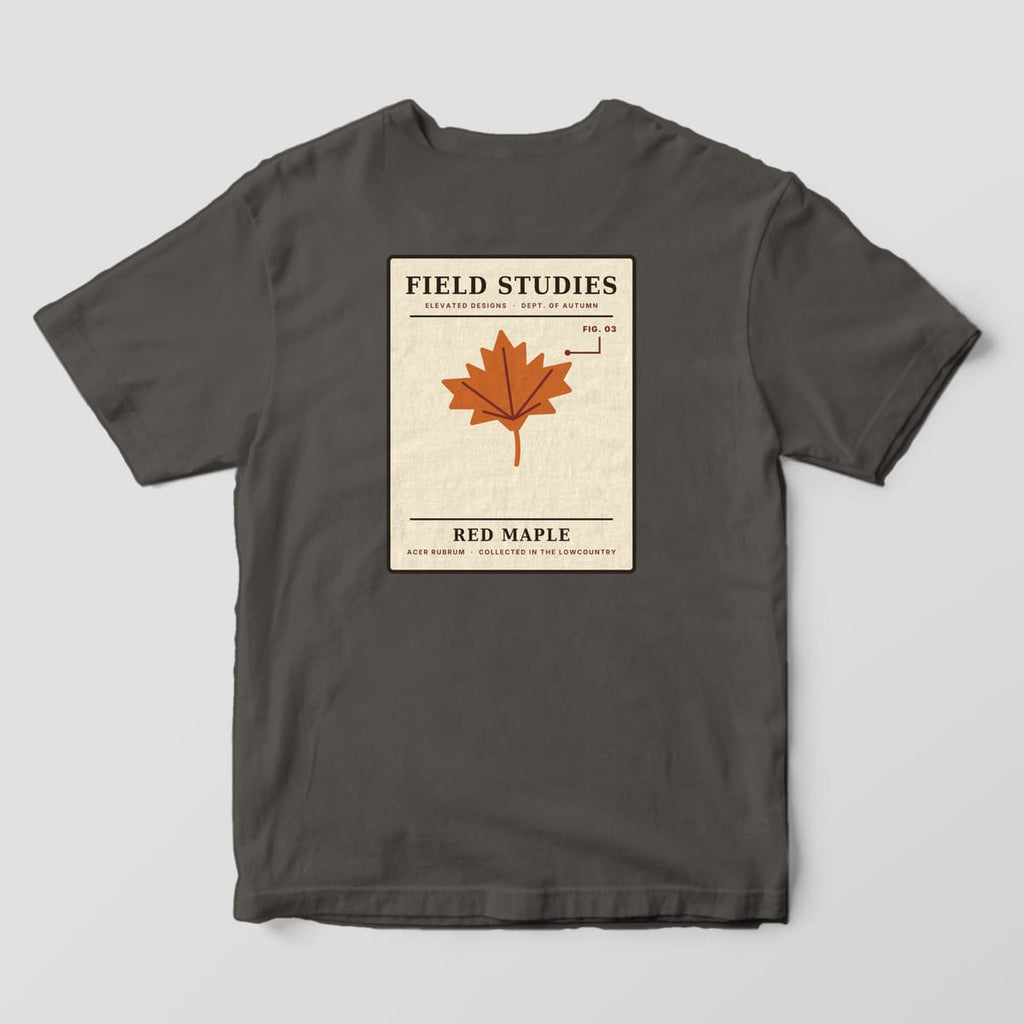 Back of a Pepper Comfort Colors 1717 tee with a cream specimen card reading FIELD STUDIES and RED MAPLE with a rust maple leaf, a FIG. 03 callout and ACER RUBRUM · COLLECTED IN THE LOWCOUNTRY.
