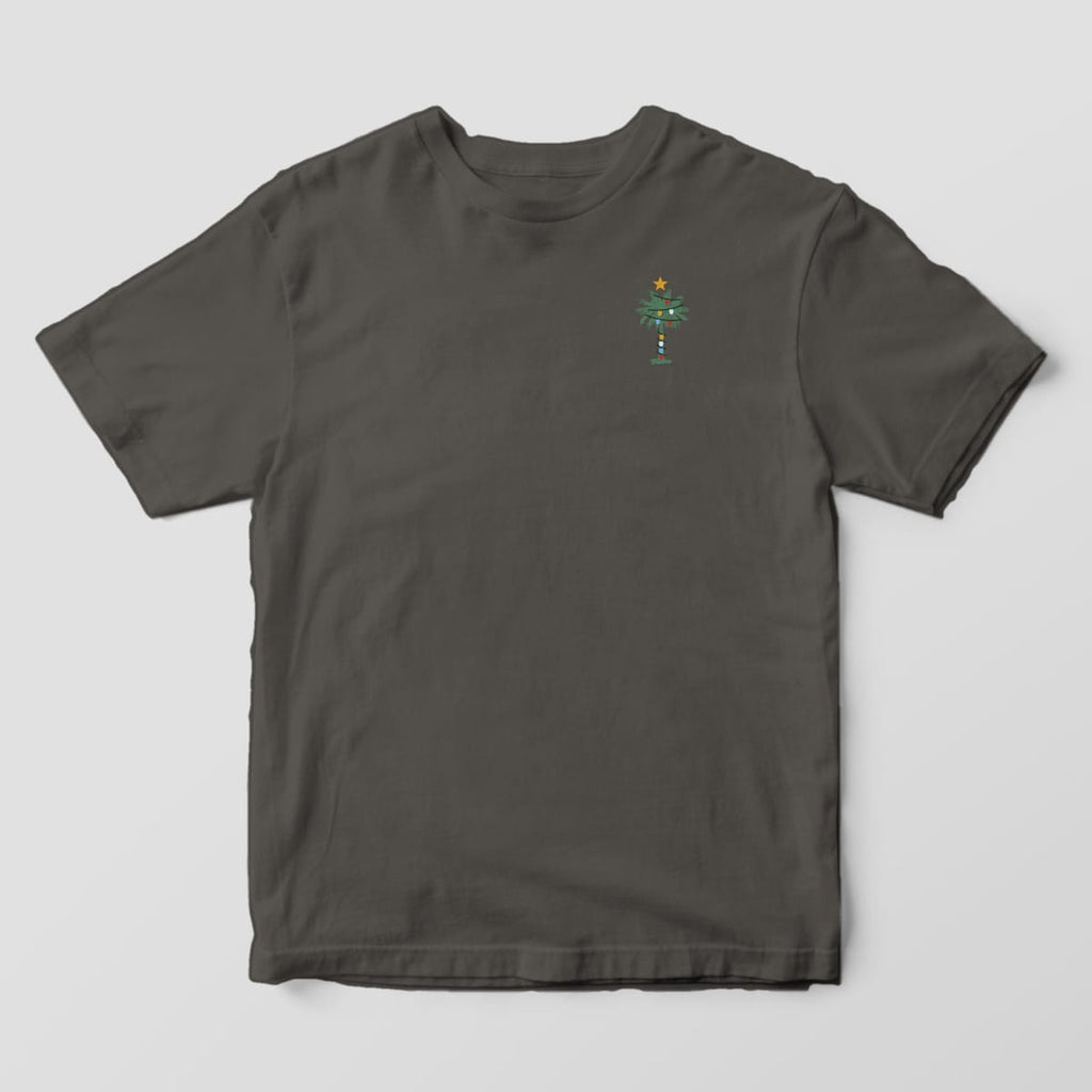 Front of a Pepper Comfort Colors 1717 tee with a small left-chest green palmetto wrapped in colorful string lights with a gold star on top.