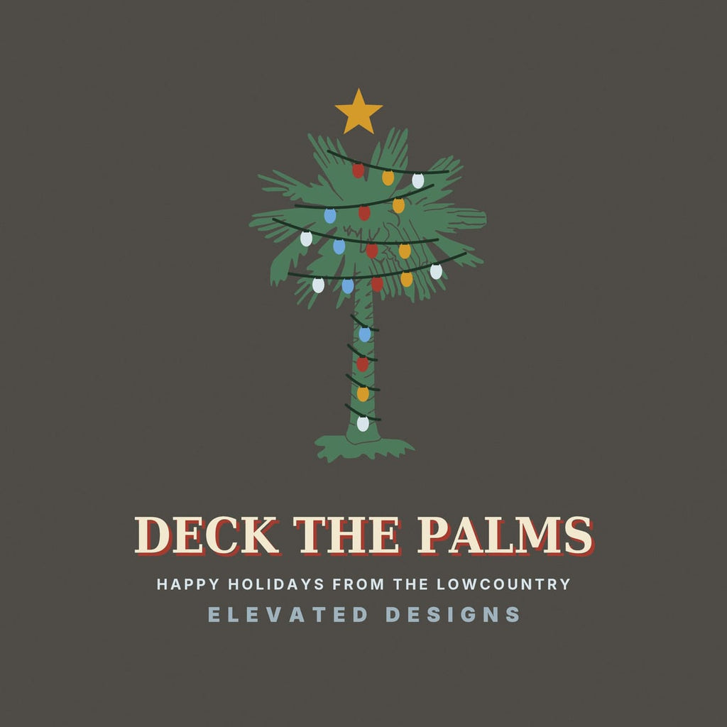 Close-up of the Deck the Palms print: a green palmetto with dark light strands looping across the fronds and trunk, red, gold, blue and white bulbs and a gold star.
