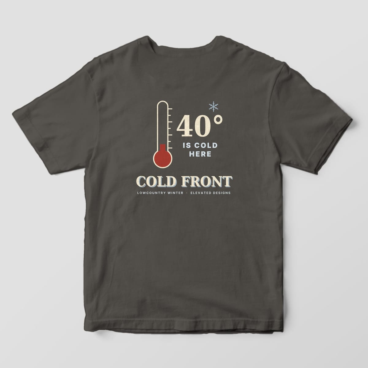 Back of a Pepper Comfort Colors 1717 tee with a cream thermometer with a red bulb and a pale blue snowflake beside 40° IS COLD HERE, above COLD FRONT and LOWCOUNTRY WINTER · ELEVATED DESIGNS.