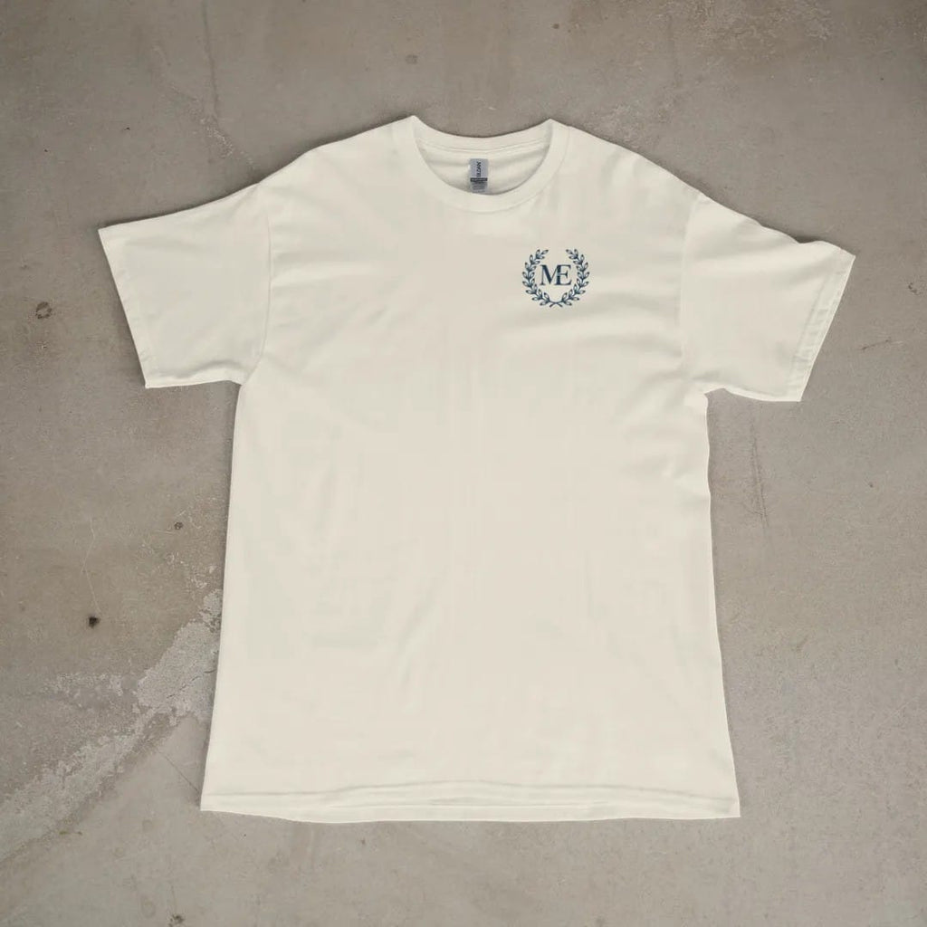 Front of a Ivory tee laid flat, with the small Maison Elevé logo on the left chest.