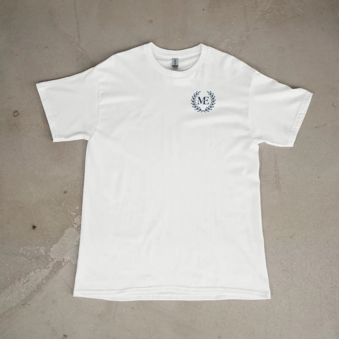 Front of a White tee laid flat, with the small Maison Elevé logo on the left chest.
