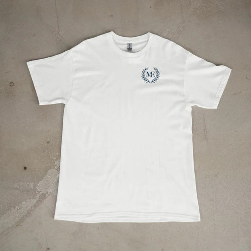Front of a White tee laid flat, with the small Maison Elevé logo on the left chest.