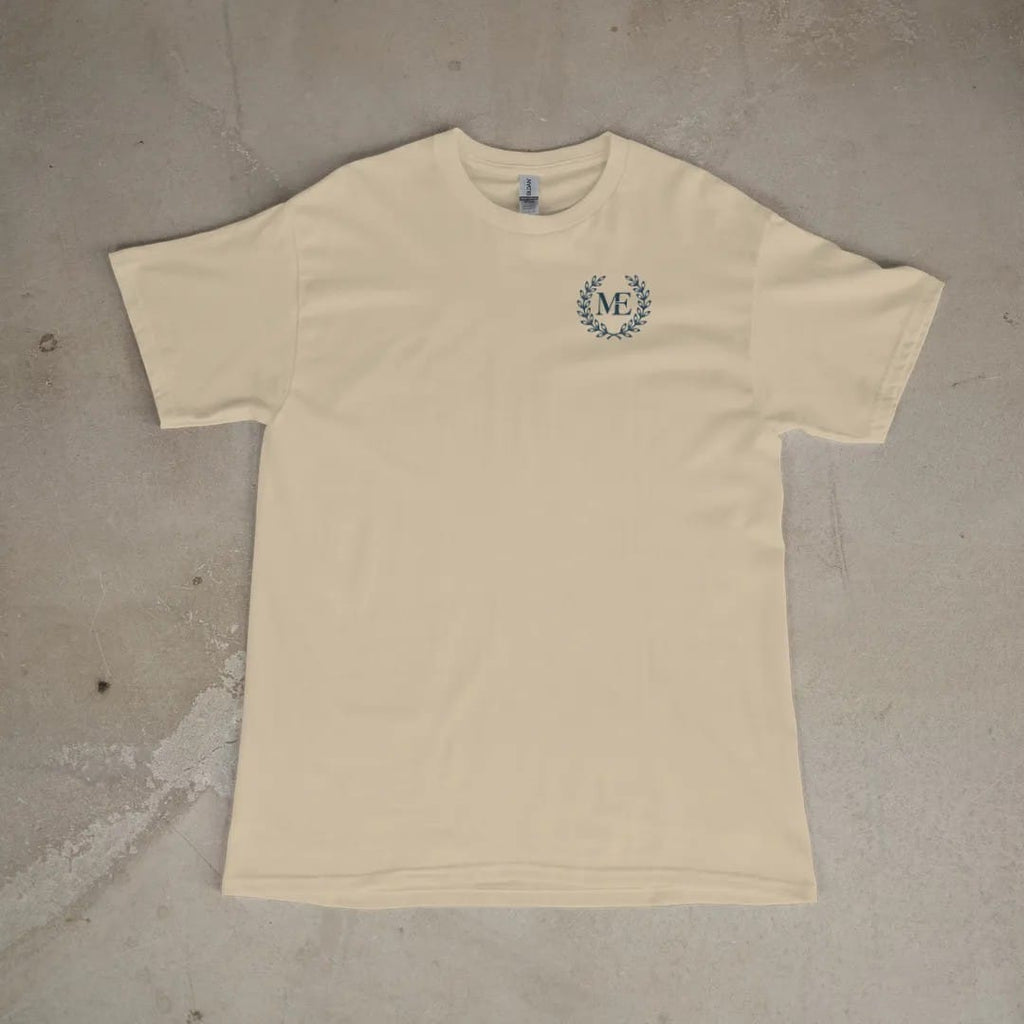 Front of a Sandstone tee laid flat, with the small Maison Elevé logo on the left chest.