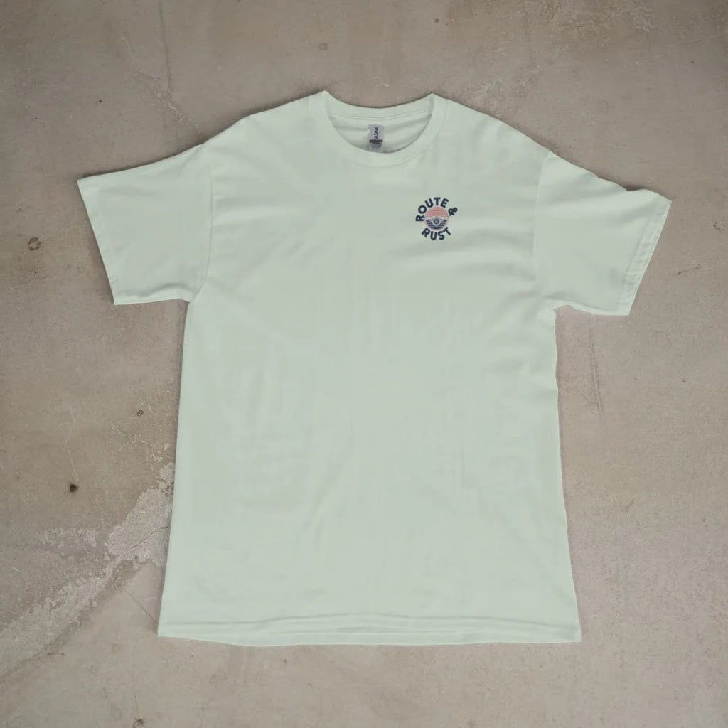 Front of a Bay tee laid flat, with the small Route & Rust logo on the left chest.