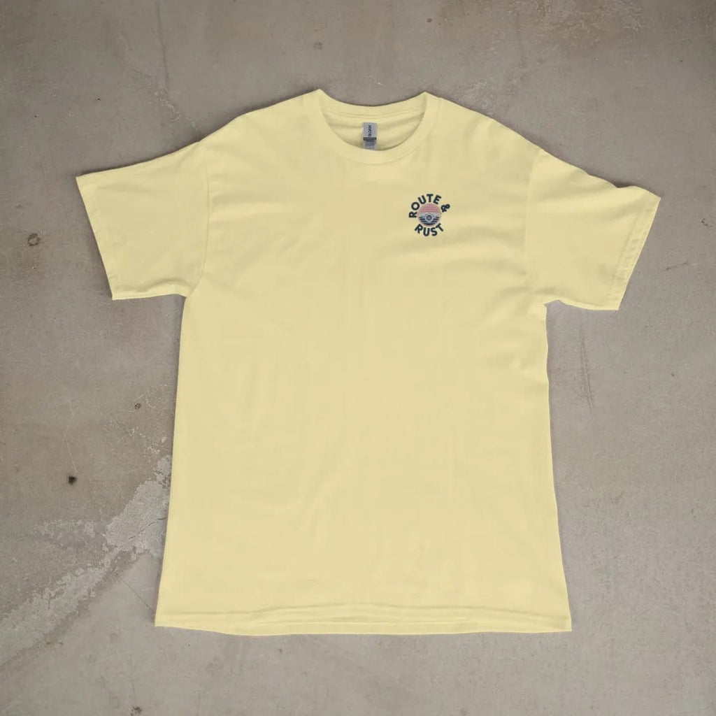 Front of a Butter tee laid flat, with the small Route & Rust logo on the left chest.