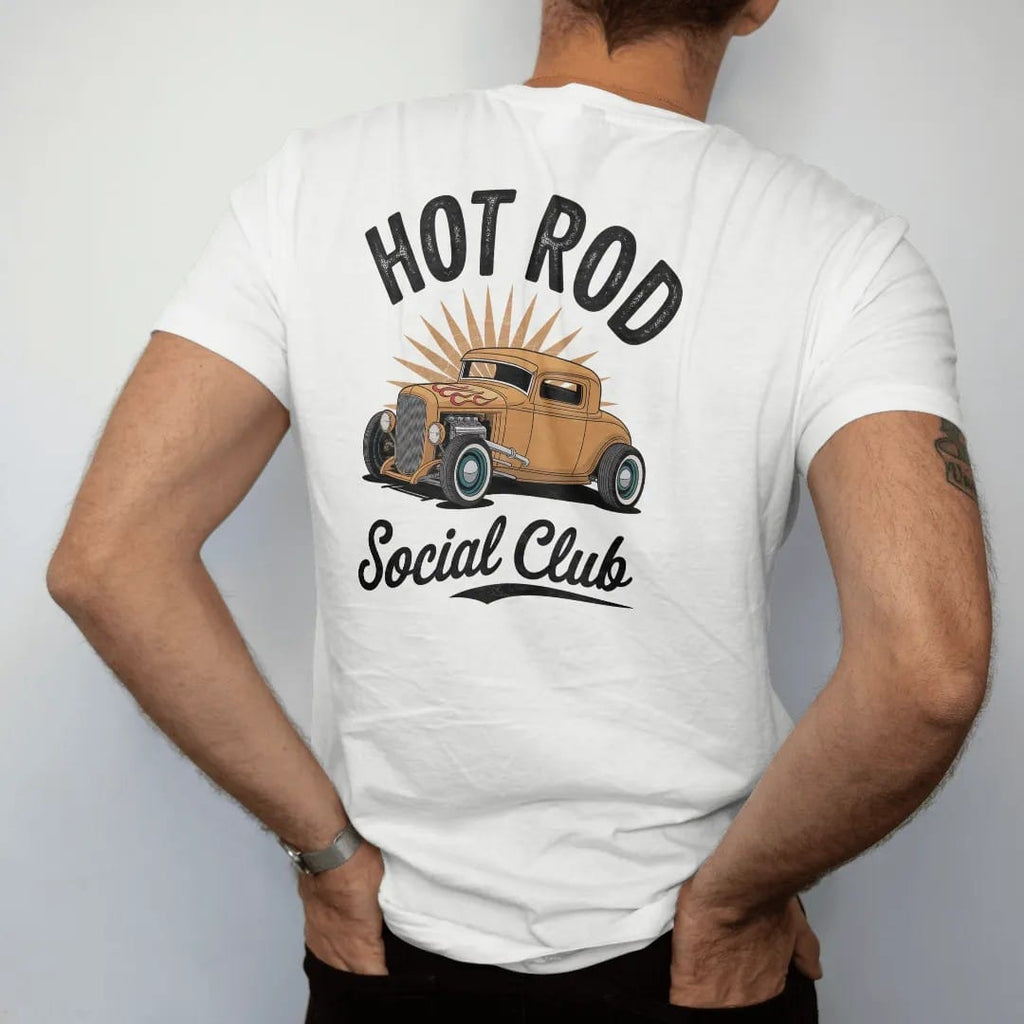 Man wearing a White tee, seen from the back: a chopped hot rod coupe with hood flames and pinstripes, with "HOT ROD" and "SOCIAL CLUB" in chunky 70s lettering and brush script, printed in faded, cracked cream, mustard, burnt orange and dusty teal…