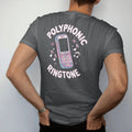 Man wearing a Graphite tee, seen from the back: a candy-bar cell phone ringing with pixel music notes, with "POLYPHONIC" and "RINGTONE" in liquid-chrome bubble letters and small pixel type, printed in glossy chrome silver, baby blue, bubblegum pink…