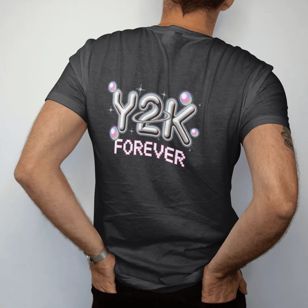Man wearing a Black tee, seen from the back: big chrome bubble letters with star sparkles and an orbit ring, with "Y2K" and "FOREVER" in liquid-chrome bubble letters and small pixel type, printed in glossy gunmetal chrome, cobalt, hot magenta and…