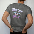 Man wearing a Pepper tee, seen from the back: sparkly glitter lettering with falling twinkle stars, with "GLITTER" and "TEXT ONLY" in liquid-chrome bubble letters and small pixel type, printed in glossy gunmetal chrome, cobalt, hot magenta and…