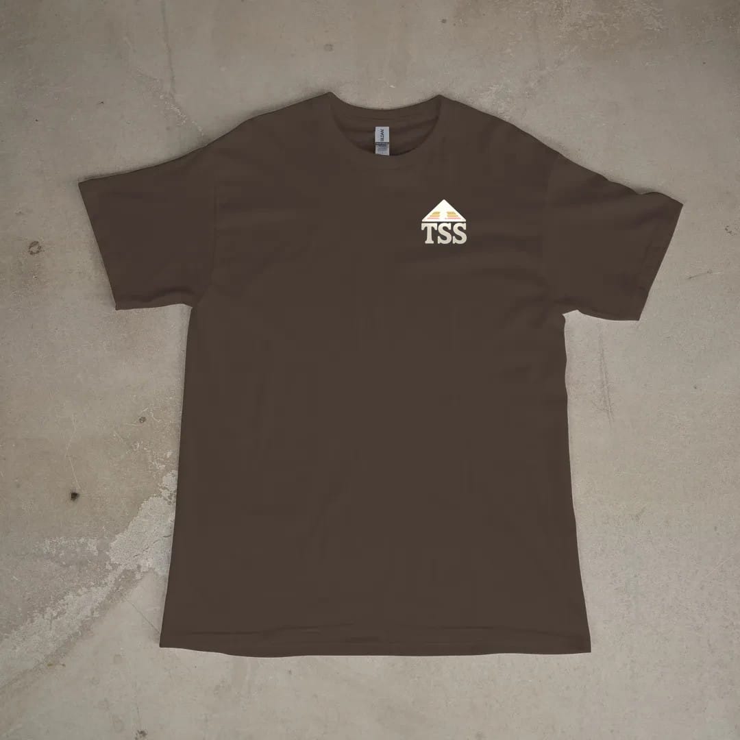 Front of a Espresso tee laid flat, with the small Trailhead Standard logo on the left chest.