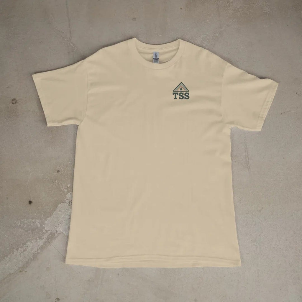 Front of a Sandstone tee laid flat, with the small Trailhead Standard logo on the left chest.