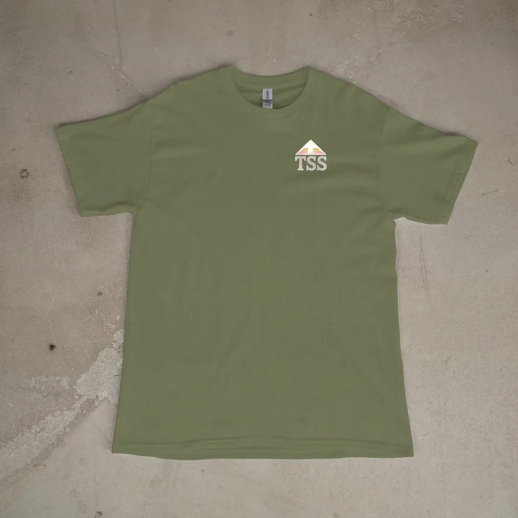 Front of a Moss tee laid flat, with the small Trailhead Standard logo on the left chest.
