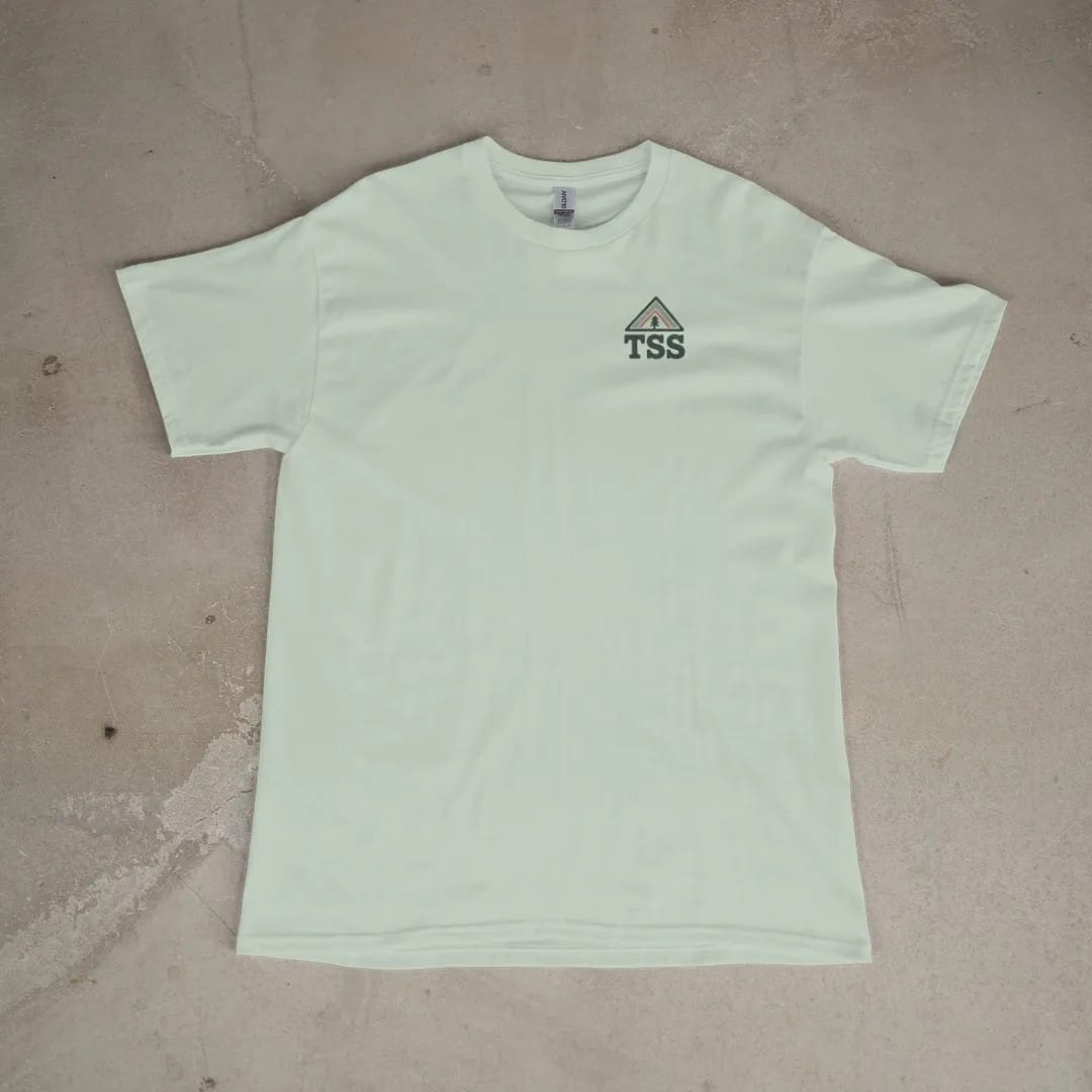 Front of a Bay tee laid flat, with the small Trailhead Standard logo on the left chest.