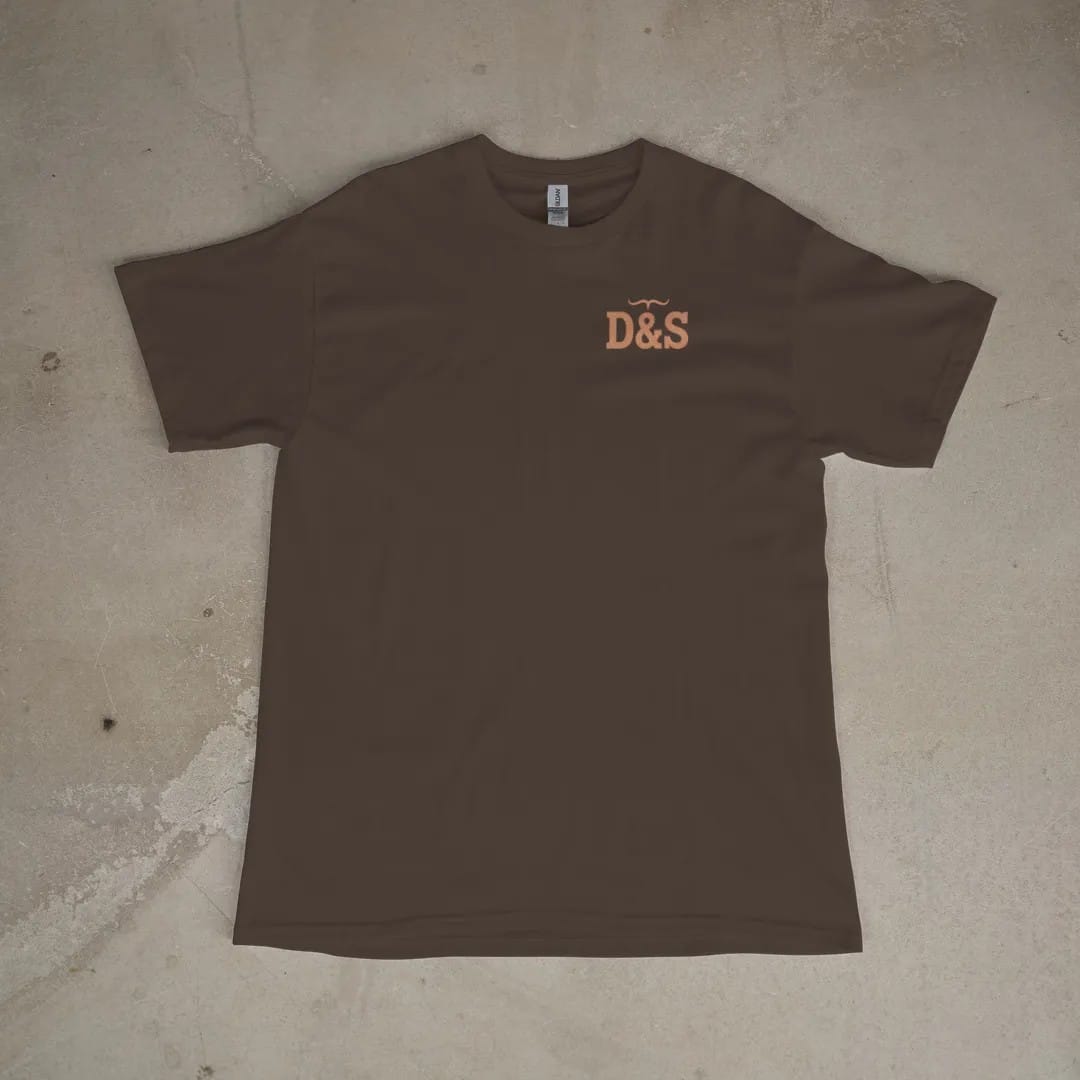 Front of a Espresso tee laid flat, with the small Dust & Spur logo on the left chest.