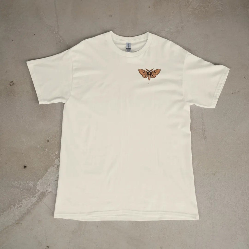 Front of a Ivory tee laid flat, with the small Nocturne logo on the left chest.