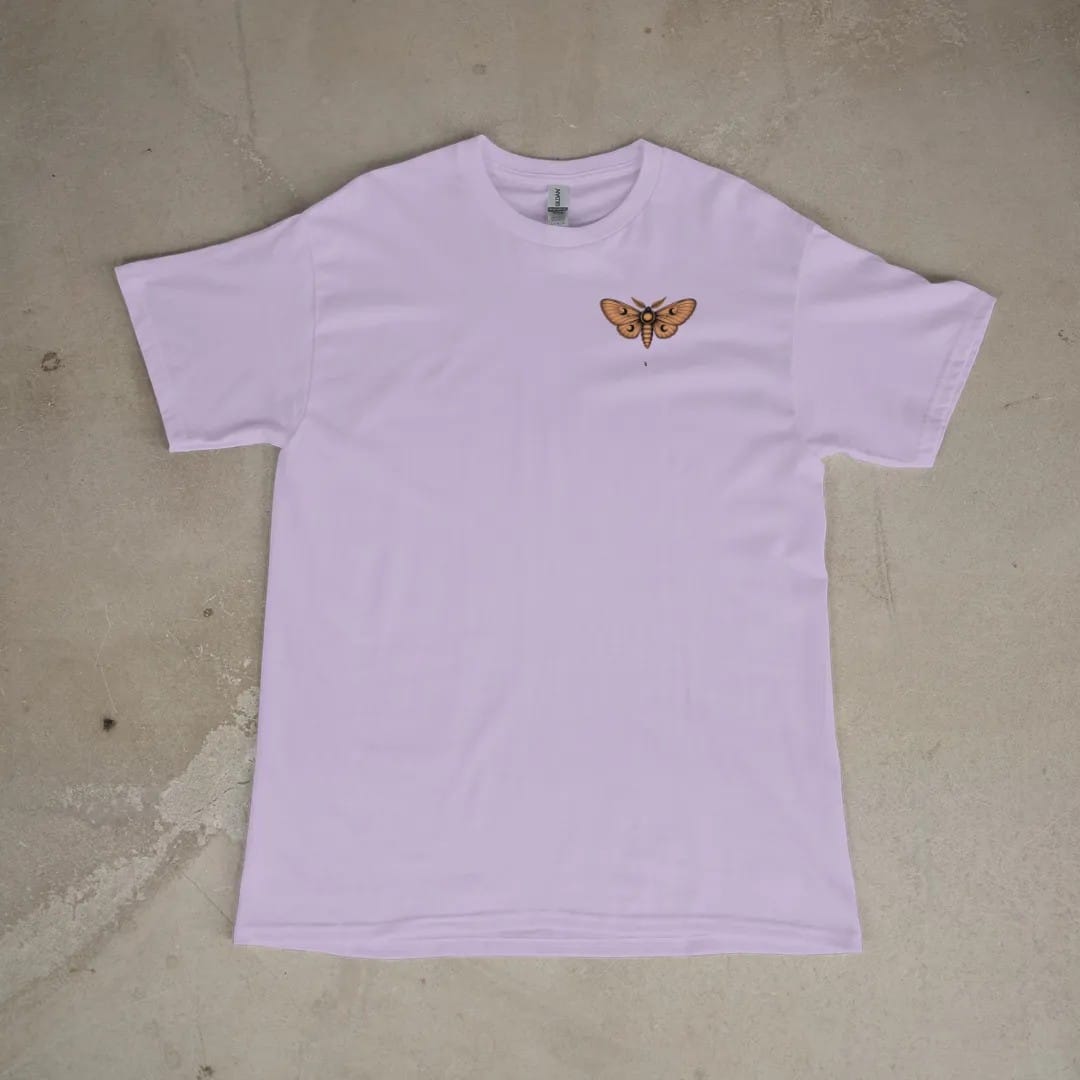 Front of a Orchid tee laid flat, with the small Nocturne logo on the left chest.