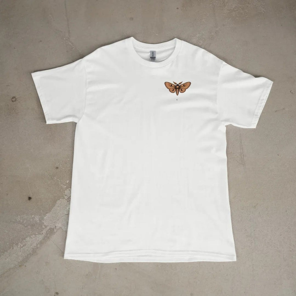 Front of a White tee laid flat, with the small Nocturne logo on the left chest.