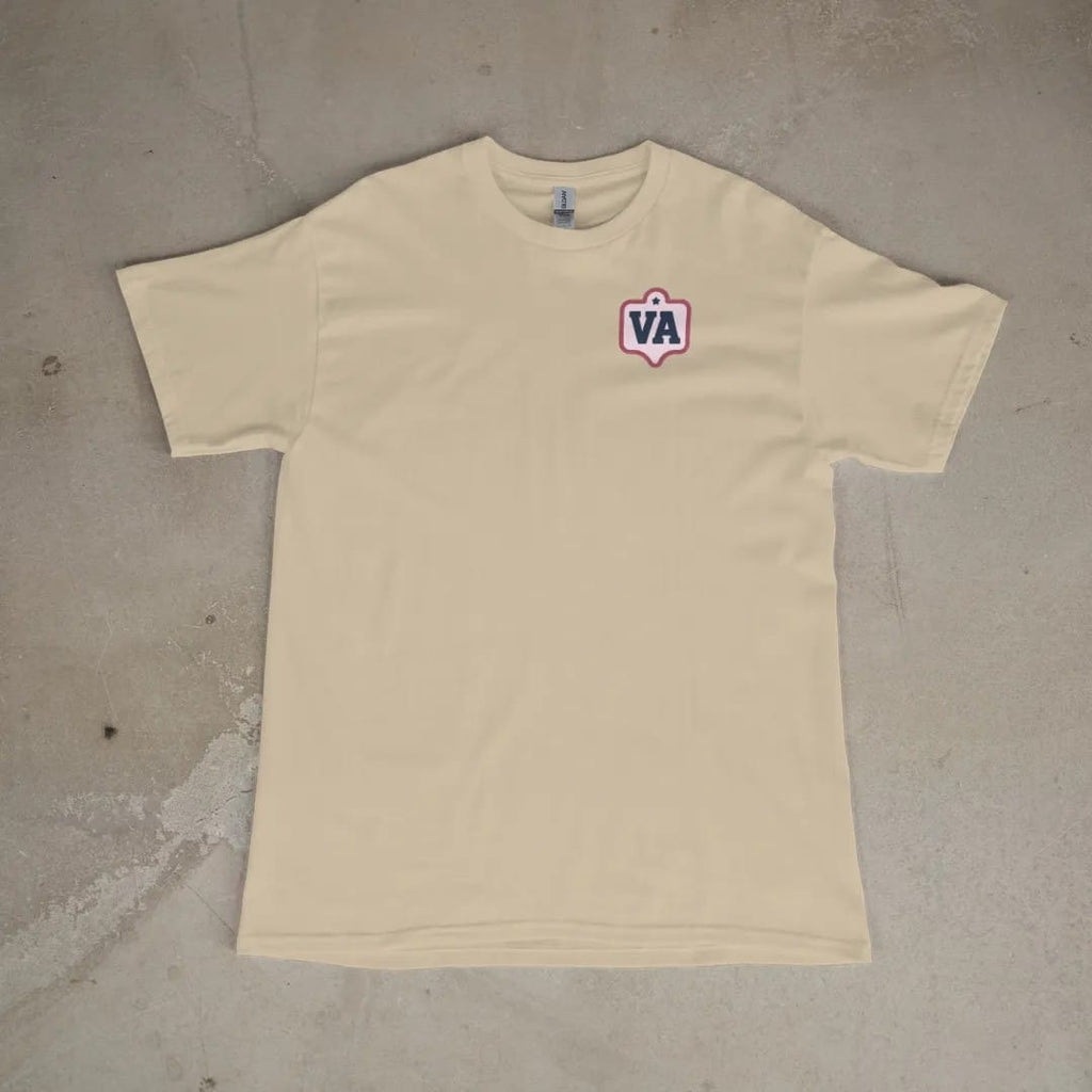 Front of a Sandstone tee laid flat, with the small Varsity Archive logo on the left chest.