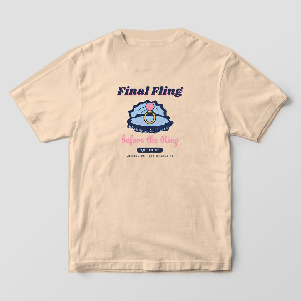 Back of an ivory Comfort Colors 1717 tee with the Final Fling oyster and pearl ring design and THE BRIDE tab. A matching THE CREW version is available.