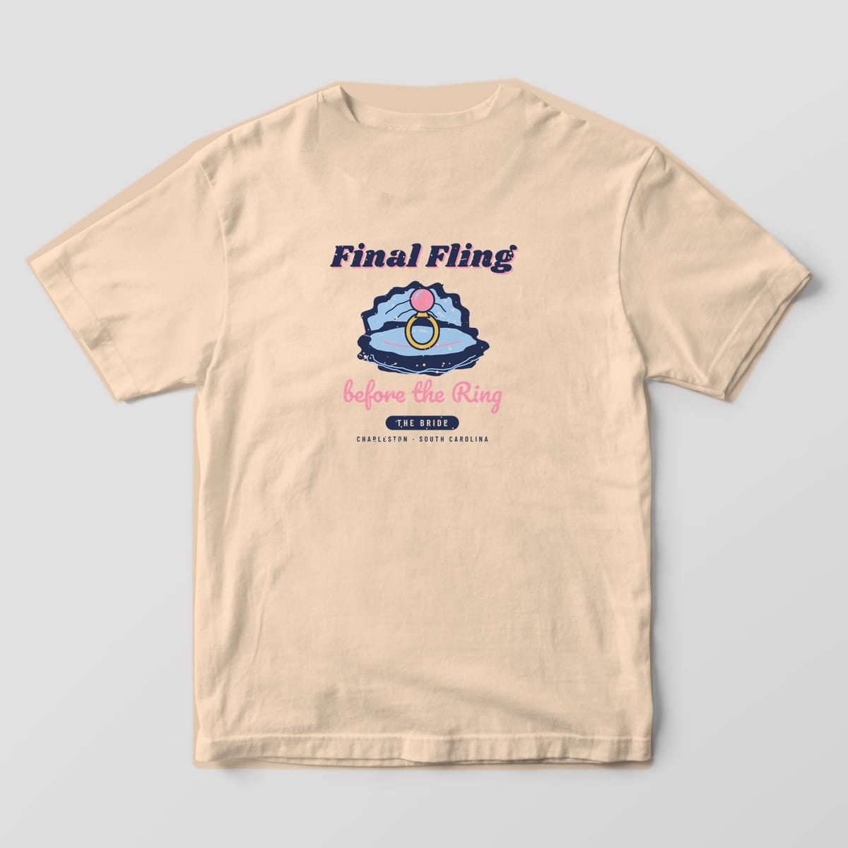 Back of an ivory Comfort Colors 1717 tee with the Final Fling oyster and pearl ring design and THE BRIDE tab. A matching THE CREW version is available.