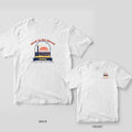 White Comfort Colors tee with a retro back print of a sunset, waves and the Sullivan's Island lighthouse in an arched window, Bach to the Beach, and Ashley on a ribbon.
