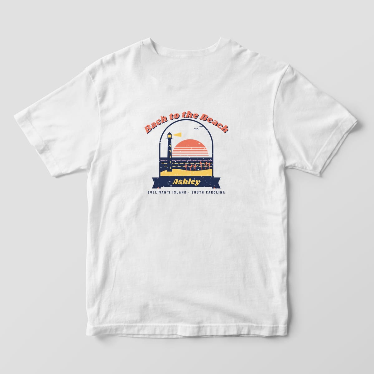 Back of a white Comfort Colors 1717 tee: coral Bach to the Beach arched over a beach scene with striped sun, navy ocean, dune, sea oats and lighthouse, name ribbon below.