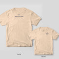Ivory Comfort Colors tee back and front with navy Mother of the Bride lettering and crossed palmetto fronds